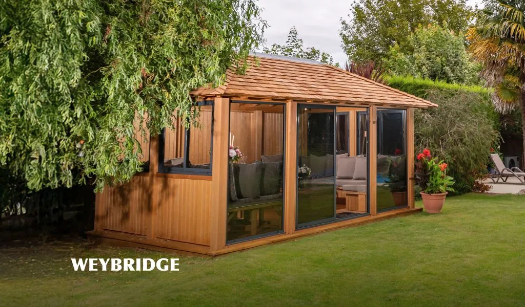 wooden gazebo in picturesque garden with a swimming pool