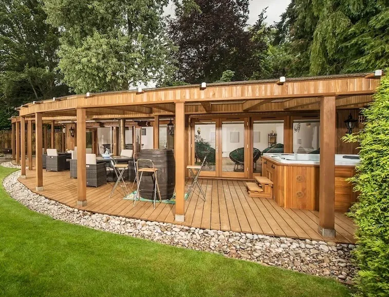 Garden room with hot tub and seating area