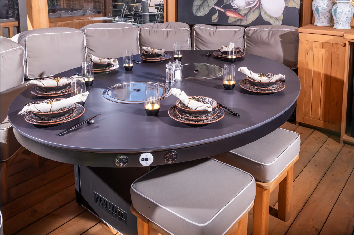 Crown Pavilions Smokeless BBQ integrated into a dining table inside a wooden gazebo