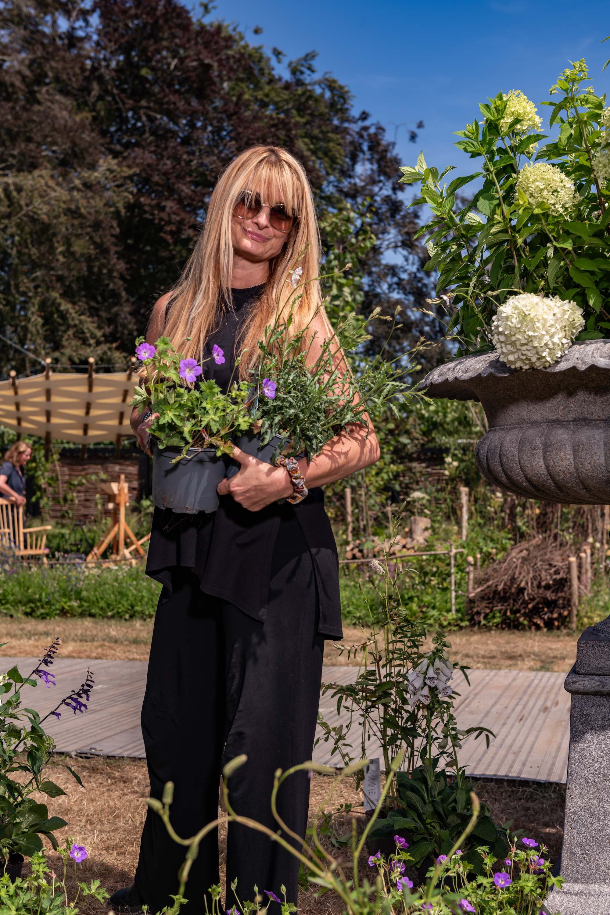 Natalie Dejahang holding architectural show planting at the RHS Badminton Flower Show