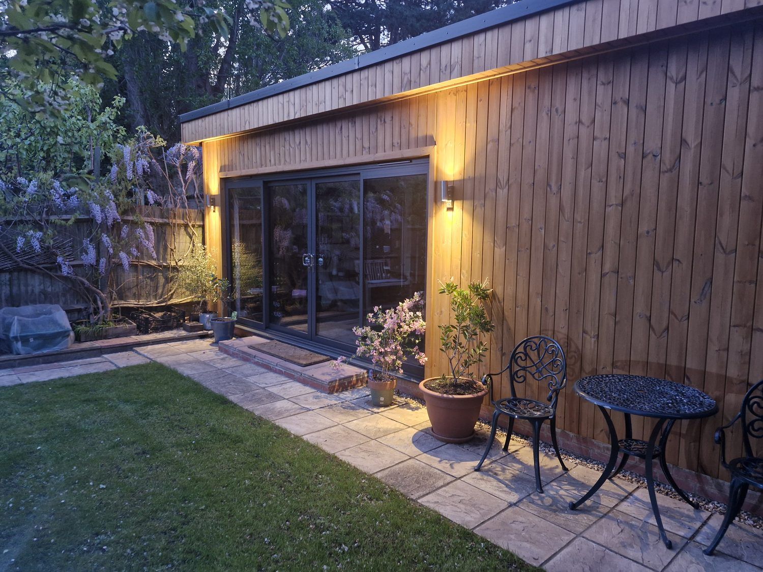 A garden room built around a gym and a music studio