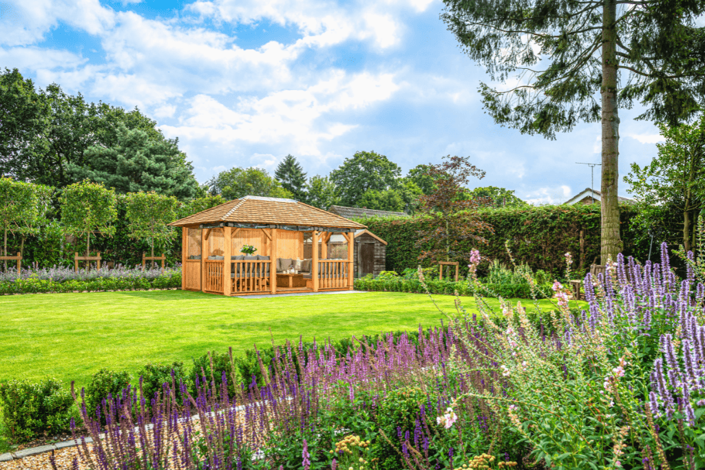 Crown Pavilions luxury outdoor garden room surrounded by a beautifully landscaped sensory garden